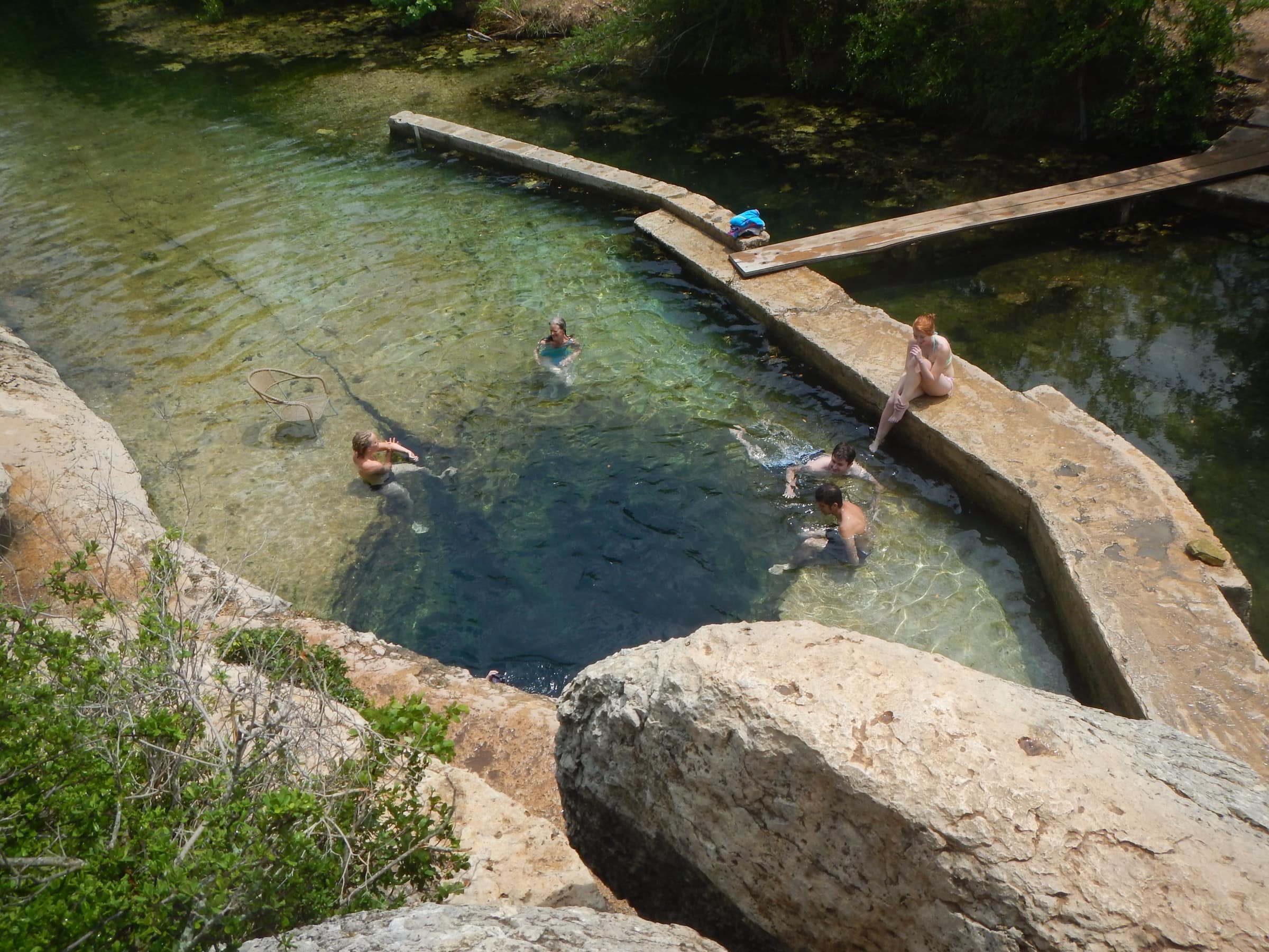 Jacob's Well: the spring mouth and the clear pool on Cypress Creek, seen from the limestone ledge above